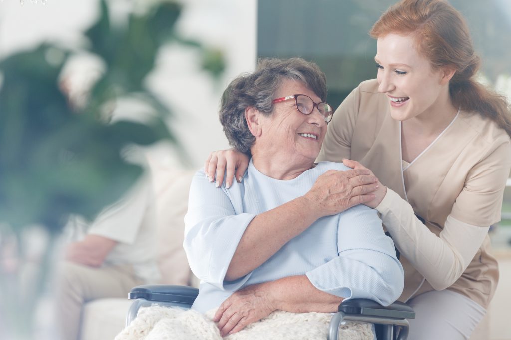 Patient and caregiver spend time together Happy patient is holding caregiver for a hand while spending time together