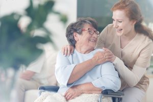 Patient and caregiver spend time together Happy patient is holding caregiver for a hand while spending time together