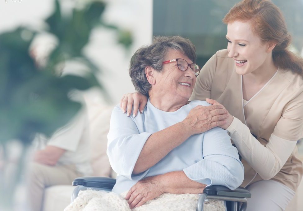 Patient and caregiver spend time together Happy patient is holding caregiver for a hand while spending time together